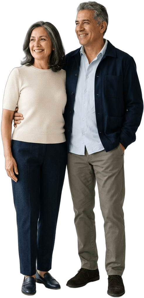 A couple in their late fifties standing together and looking toward the future